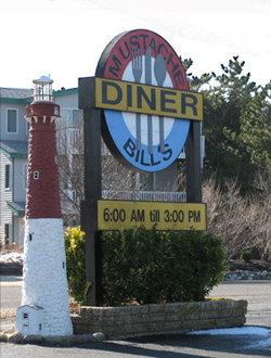 a sign for Mustache Bill's Diner